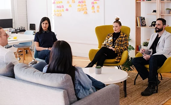 Group of people sitting around talking